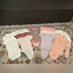 Bundle of newborn onesies